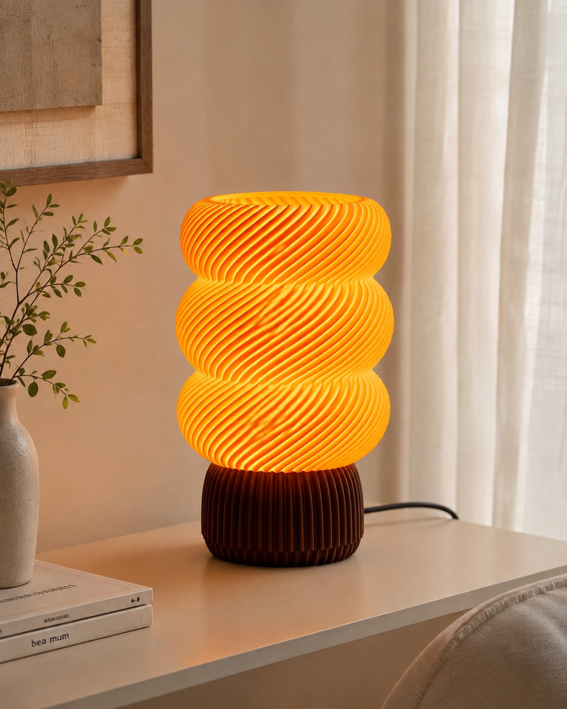 Spiral wave table lamp with burgundy base on a white bedside table with dried stems and books