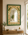 Rajasthani hand-painted peacock and lotus wall mirror above a wooden console with ceramic vase and brass bowl